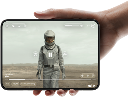iPhone Duo, held with one hand, opened in horizontal orientation, fully unfolded, interior screen displays Apple TV show “Silo”