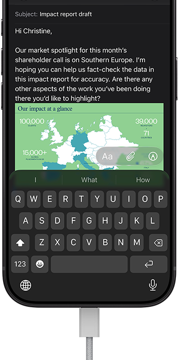 iPhone 18 Pro, black, connected to a charger, screen shows a work email in Mail