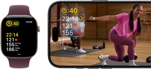 Apple Watch next to iPhone with Apple Fitness+ class on screen