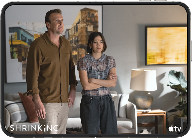 iPhone&nbsp;Duo, opened in horizontal position, Apple&nbsp;TV show “Shrinking” plays on screen
